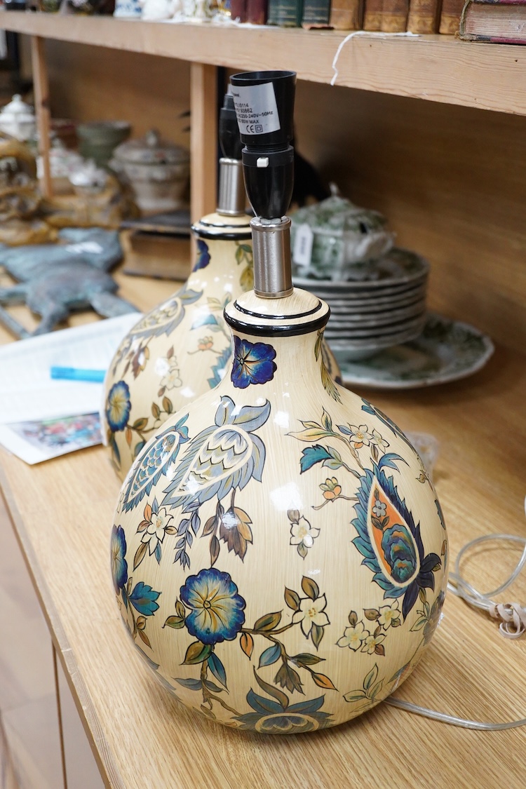 A pair of Persian inspired floral painted pottery table lamps, 33cm high